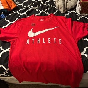 Red Nike athletic shirt